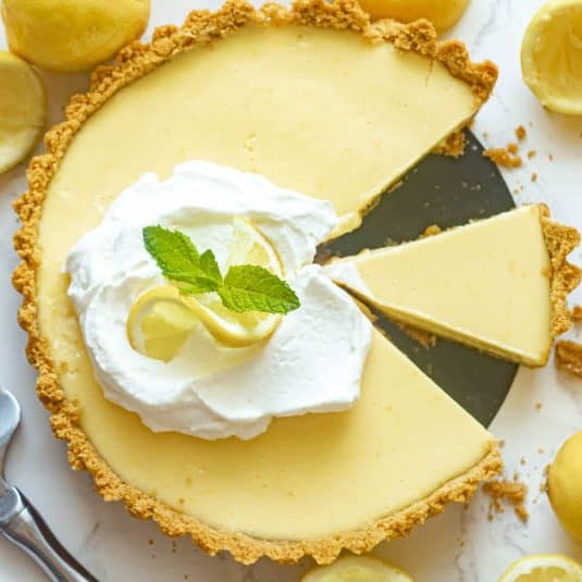 Lemon icebox pie with slices cut out.
