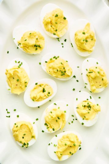 Close-up of creamy Cape Breton-style deviled eggs with chives.