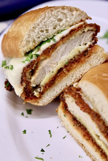 Chicken Parmesan Sandwich cut in half - close up.