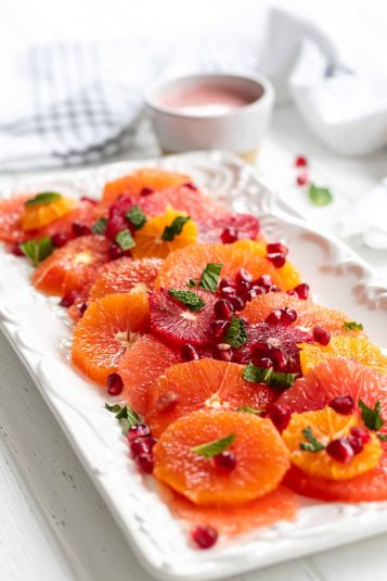 A display of Citrus Salad with Pomegranate Dressing.