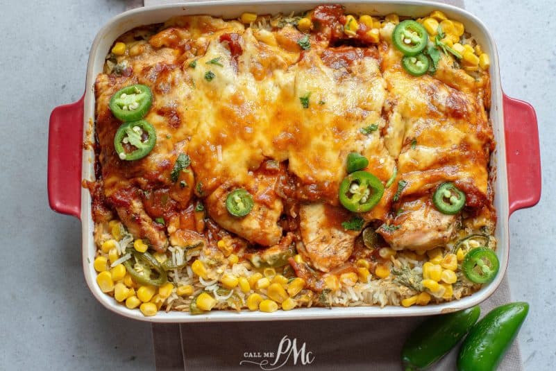Crockpot Cheesy Salsa Chicken on a plate with rice and sauce.