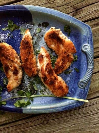 Crispy Coconut Chicken Tender on a blue plate.