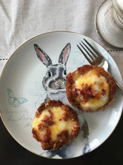 Tater tot egg nests on a bunny plate.