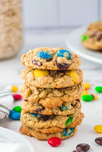 Oatmeal M and M Cookies stacked on top of one another.