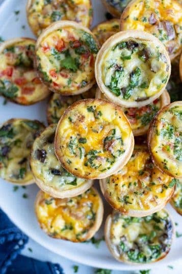 Mini quiche are shown on a plate for an easy appetizer recipe.