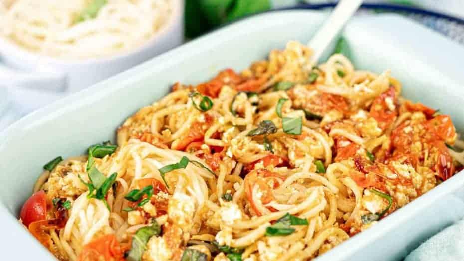 Goulash inside white casserole. 
