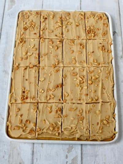 Peanut Butter Sheet Cake with cake mix scored into slices in the pan.