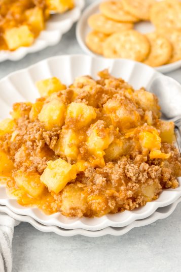 A photo of baked pineapple casserole on a plate.