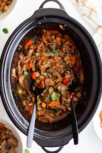 A close up image of fully cooked slow cooker pot roast with picadillo.