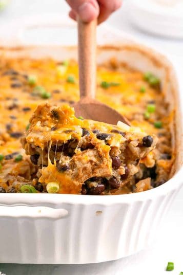 Southwest Chicken Casserole in a Baking Dish on a Serving Spoon.