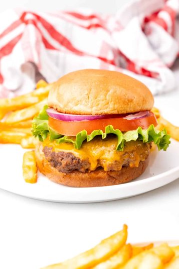 A display of Grilled Gorgonzola Buffalo Burgers in a Pretzel Bun.