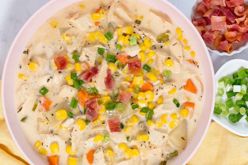 A bowl of creamy crock pot chicken corn soup with a rich, creamy texture.