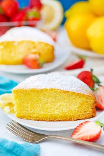 A slice of lemon ricotta cake topped with powdered sugar.
