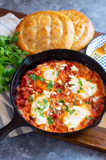 Shakshuka with feta in a cast iron pan.