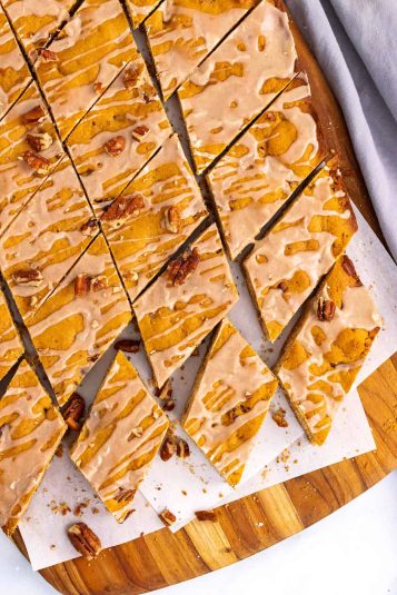 A butterscotch pie with meringue on a wire cooling rack.