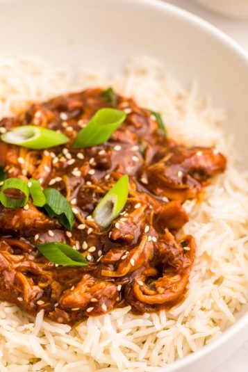 Honey Garlic Chicken on rice in a white bowl.