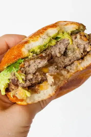 Closeup shot of Bacon Cheddar Stuffed Burger.