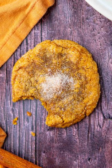 Bite taken out of a chewy sourdough pumpkin maple cookie.