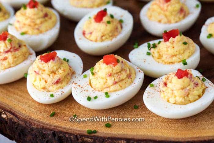 Cabot Pimento Cheese Deviled Eggs on a wooden board.