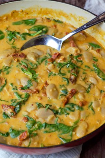 Close up of Marry Me Butter beans in a large skillet.