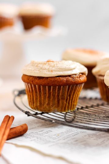 Pumpkin cupcakes with cream cheese frosting.
