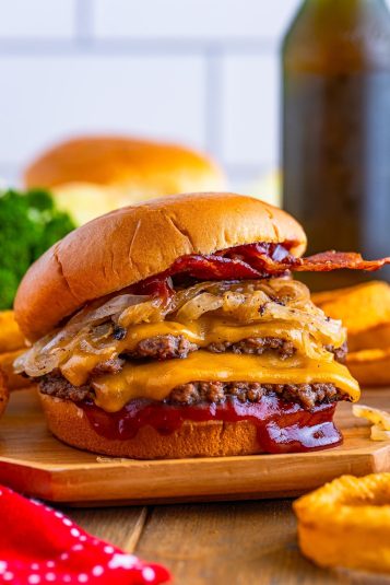 Blackstone Smash Burgers on a wooden plate.
