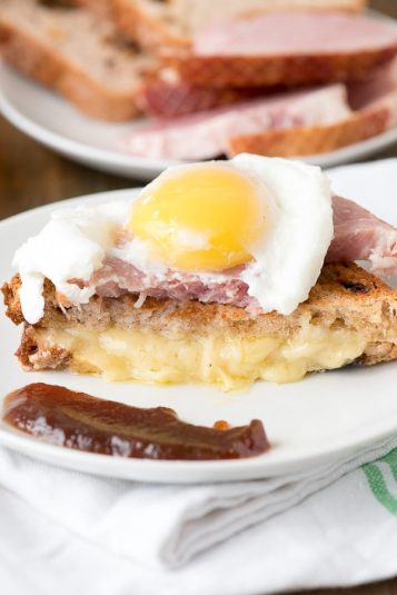 Breakfast Grilled Cheese Sandwich with Ham, Poached Egg, Apple Butter.