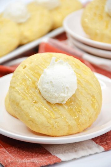 Cornbread cookies topped with honey and buttercream frosting.
