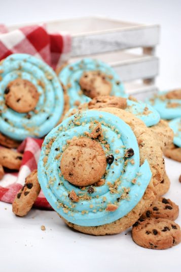 Copycat Crumbl Blue Monster cookies piled on a table.