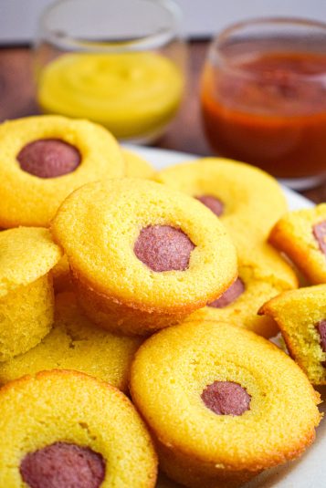 A plate of mini muffin corndog bites.