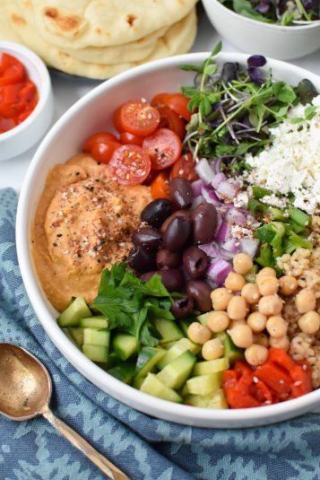 Easy Mediterranean Hummus Bowl in a white bowl.