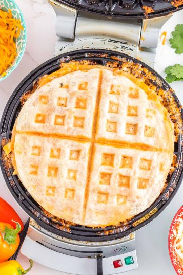 A waffle maker with a waffle inside.