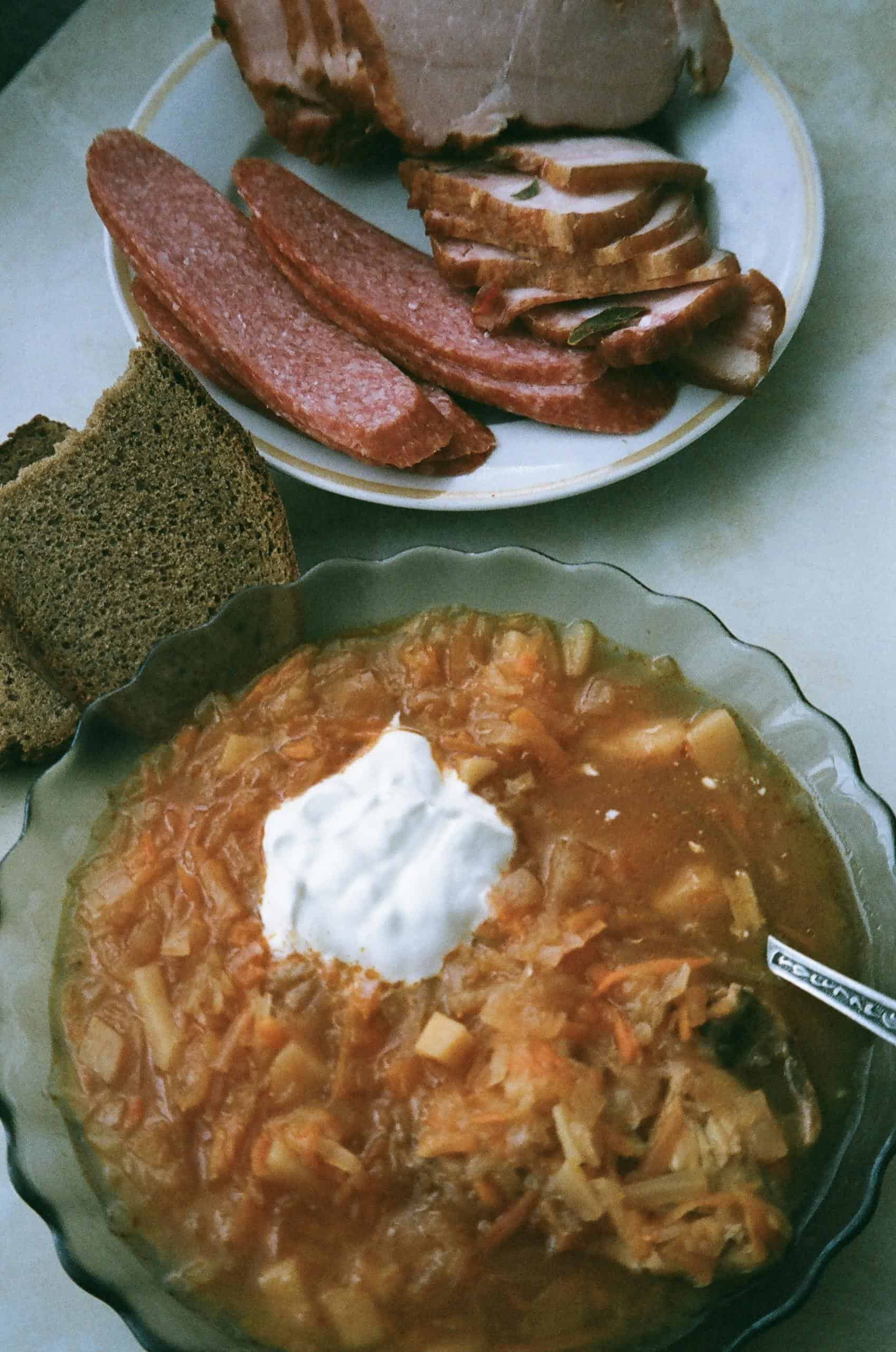 Delicious homemade borscht served with rye bread and assorted meats.