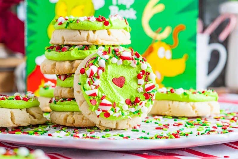 A stack of Crumbl inspired Christmas Grinch sugar cookies.