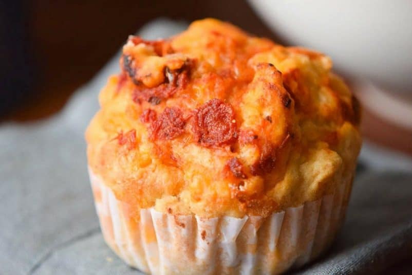 Close up of a savory pepperoni and cheese muffin.