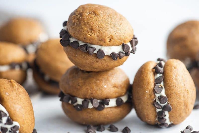 A display of Pumpkin Whoopie Pies with Cream Cheese & Chocolate Chips.