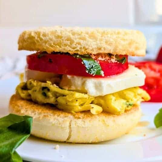 Mozzarella tomato egg sandwich recipe caprese breakfast sandwich italian breakfast meal.