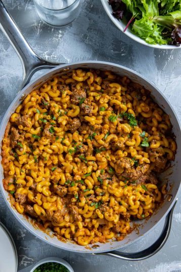 Cooked hamburger mac and cheese in skillet.