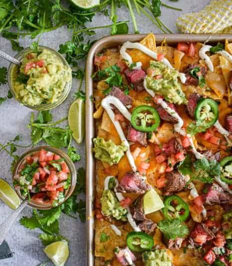 Flank steak nachos with guacamole and pico de gallo.