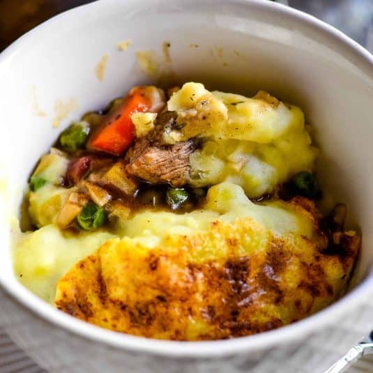 A lamb shepherd's pie served in a glass dish.