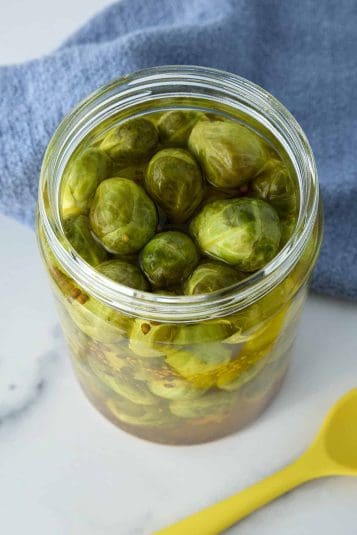 Angled overhead shot of a jar of frog balls.