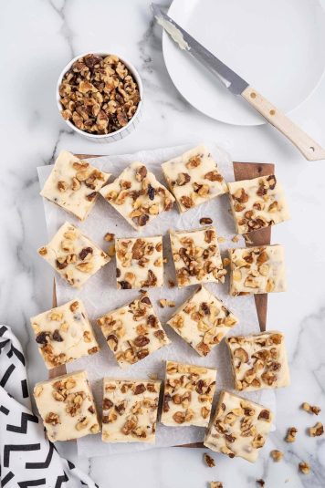 A couple of Maple Walnut Fudge over parchment paper.