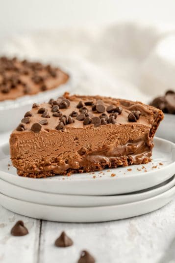 A serving of chocolate pie served with chocolate chips on top.