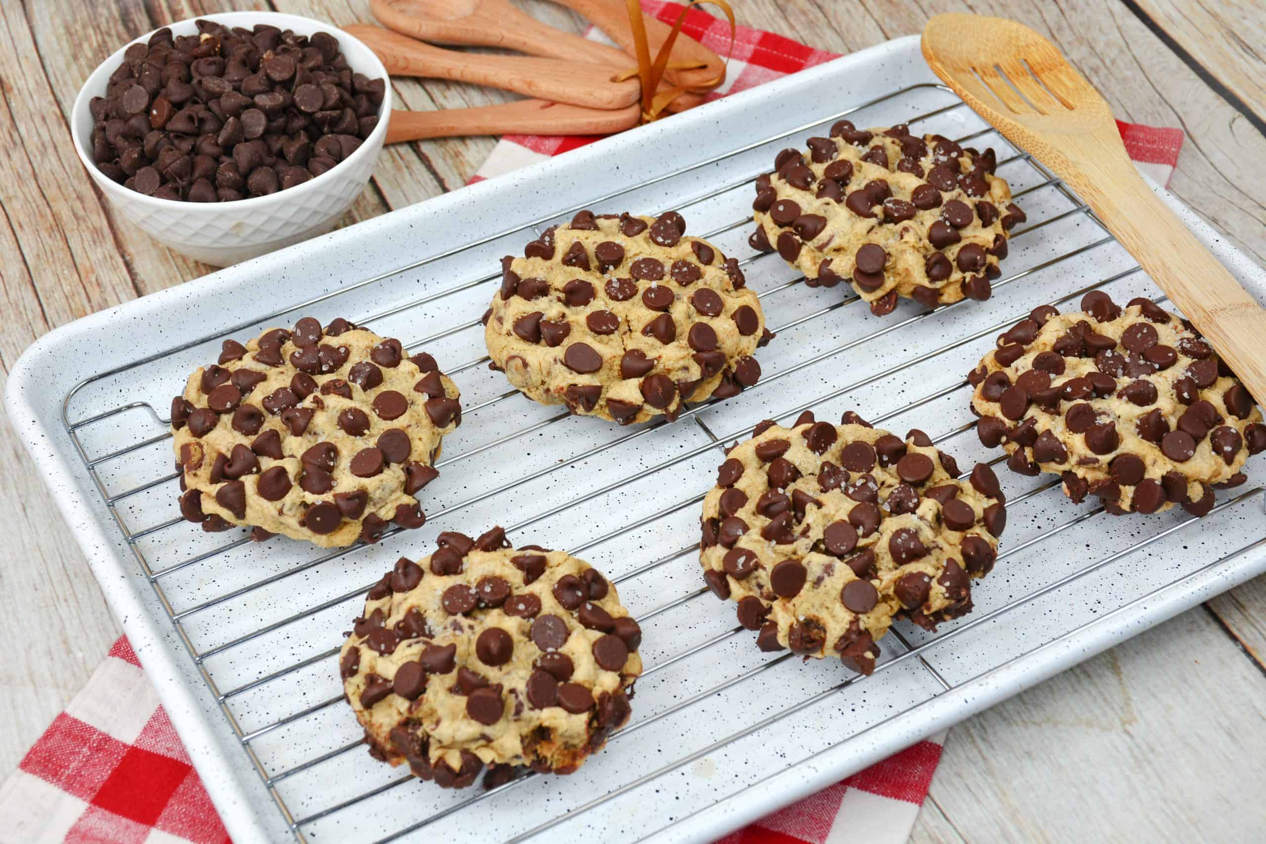 a copycat Gideon's chocolate chip cookie topped with more chocolate chips and flaky sea salt.