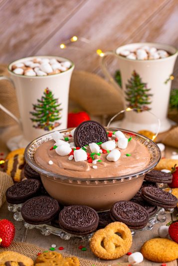 Hot Chocolate Dip in bowl garnished with hot chocolate in background.