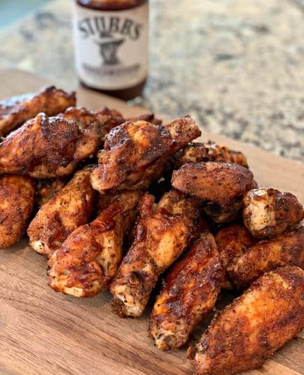 Seasoned chicken wings cooked on the smoker.