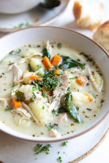 Instant pot chicken gnocchi soup in a white bowl.