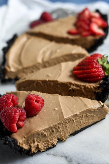 Slices of nutella no bake cheesecake with oreo crust.