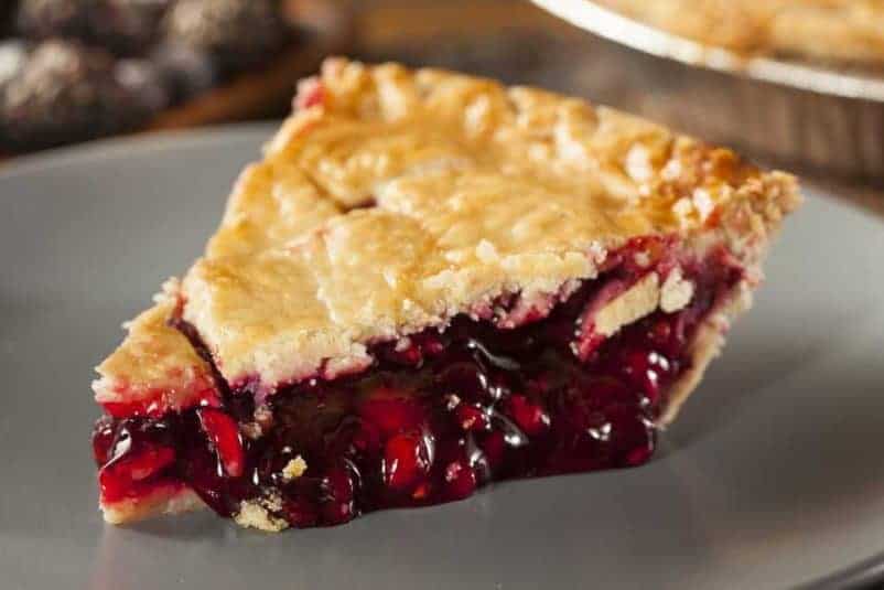A slice of Raspberry Pie on a plate.