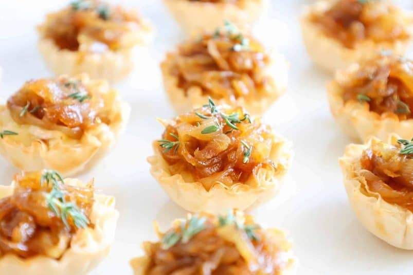 A display of Caramelized Onion Tartlets with Brie.